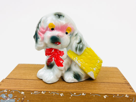 Vintage Puppy wearing a Bow and Basket Flat Ceramic Kitschy Mid Century Figurine Made in Japan